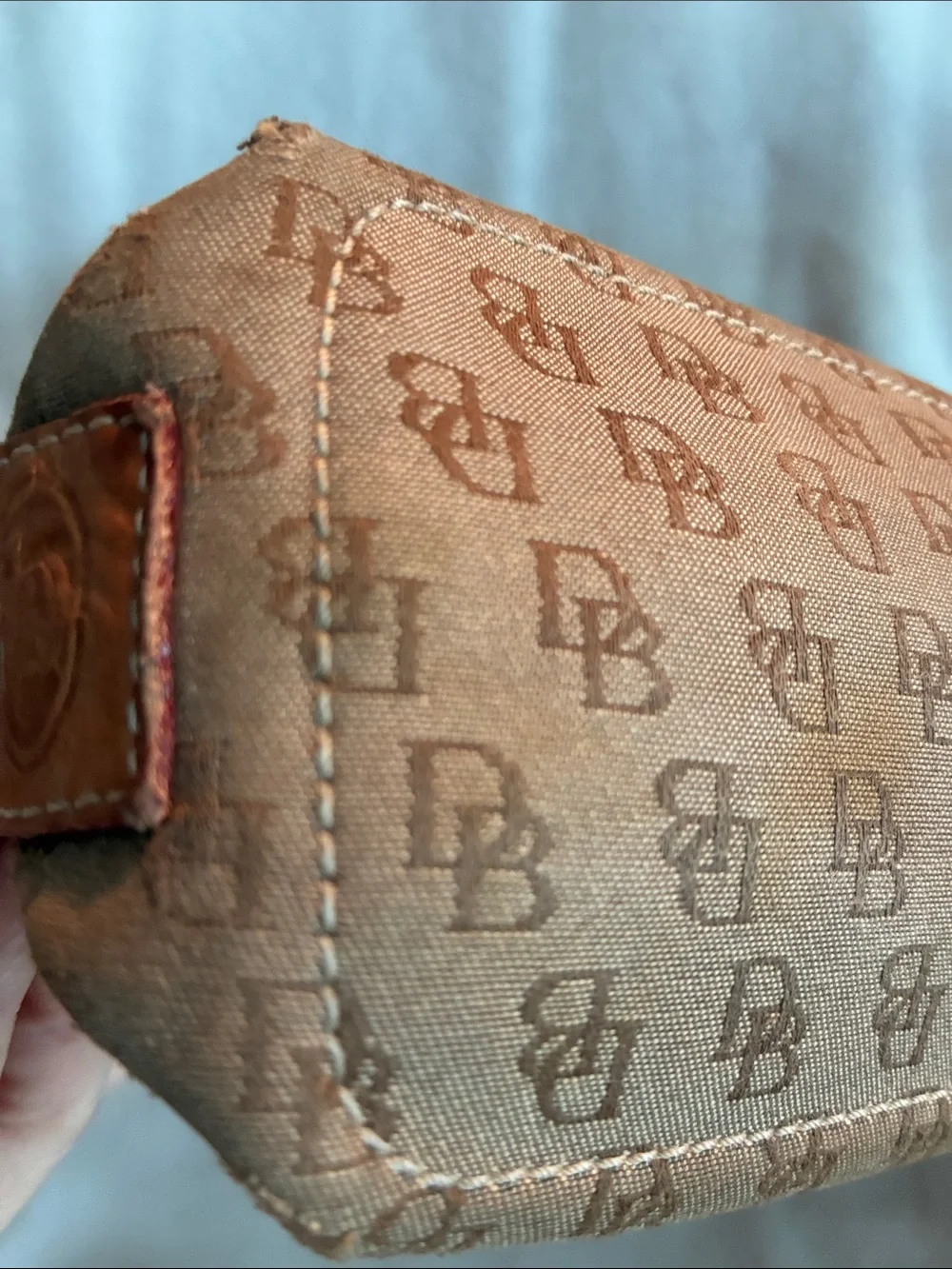 Dooney & Bourke  Brown Monogram Handbag with Tassel Accent